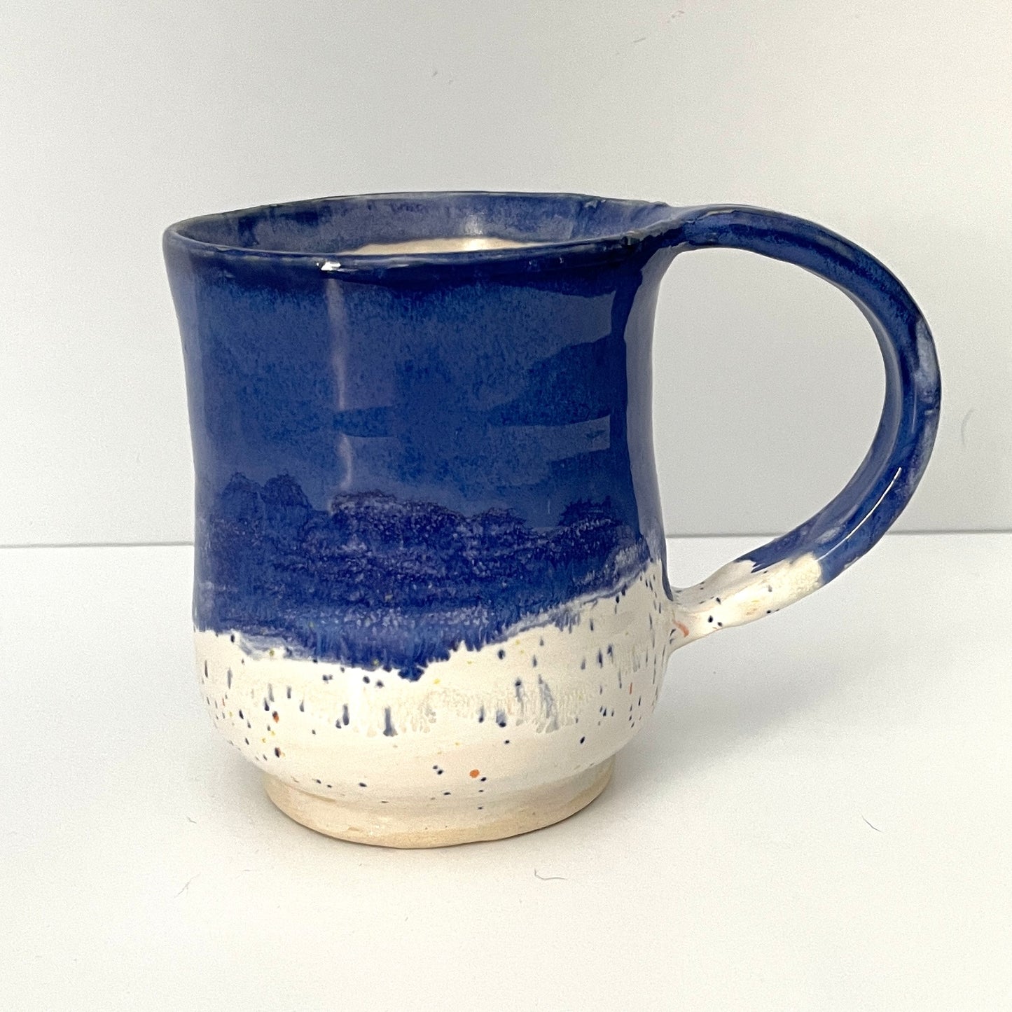 Deep blue and white speckled mug