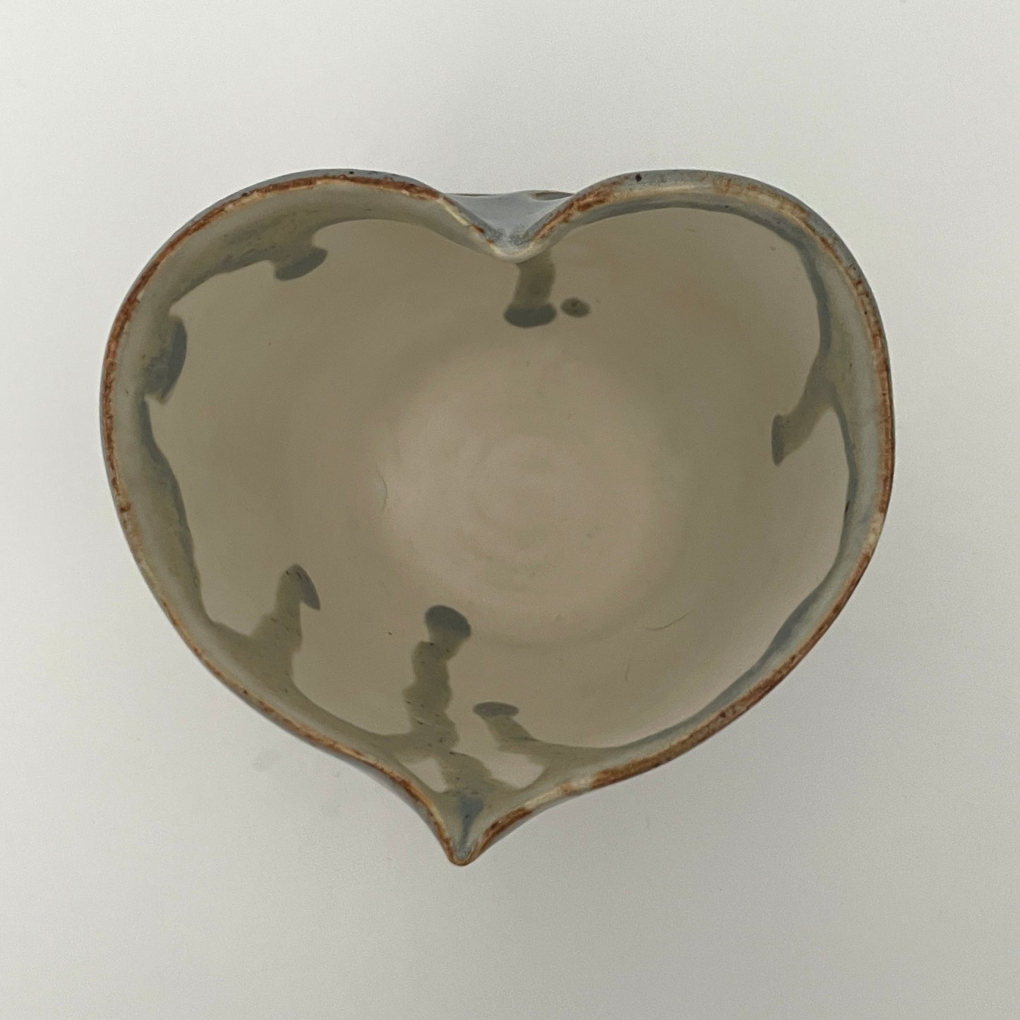 Carved light blue ceramic cups shaped like hearts