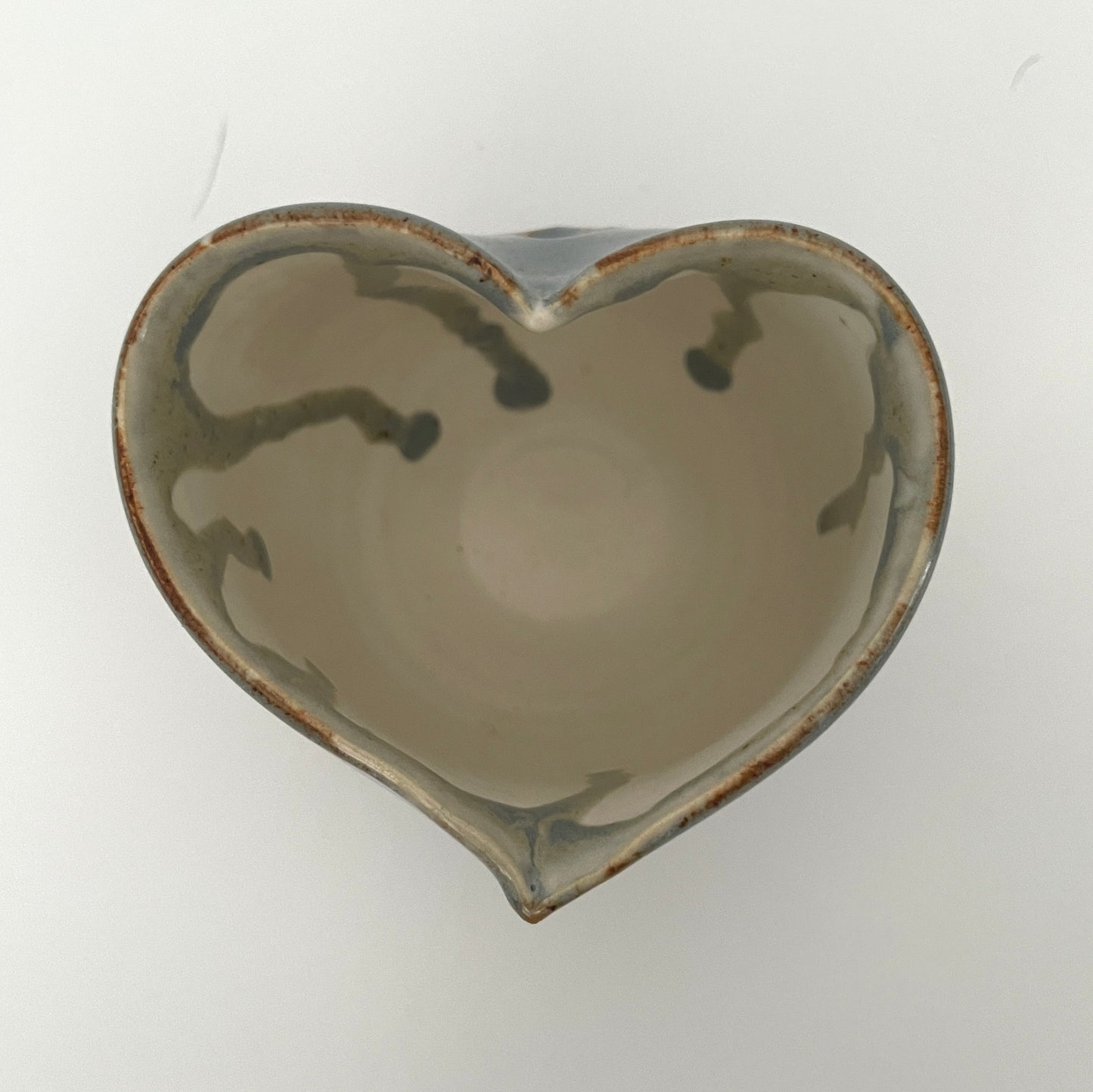 Carved light blue ceramic cups shaped like hearts