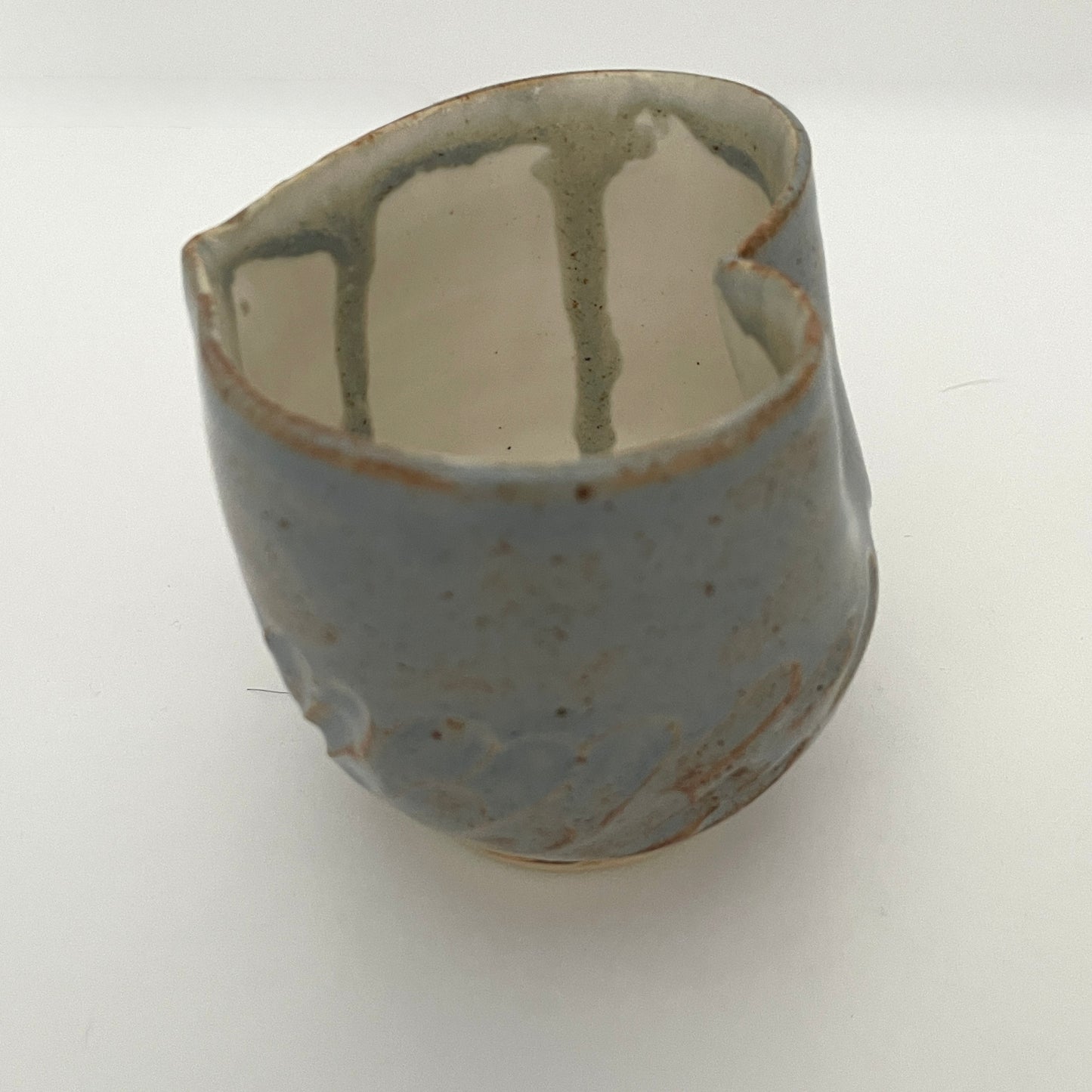 Carved light blue ceramic cups shaped like hearts