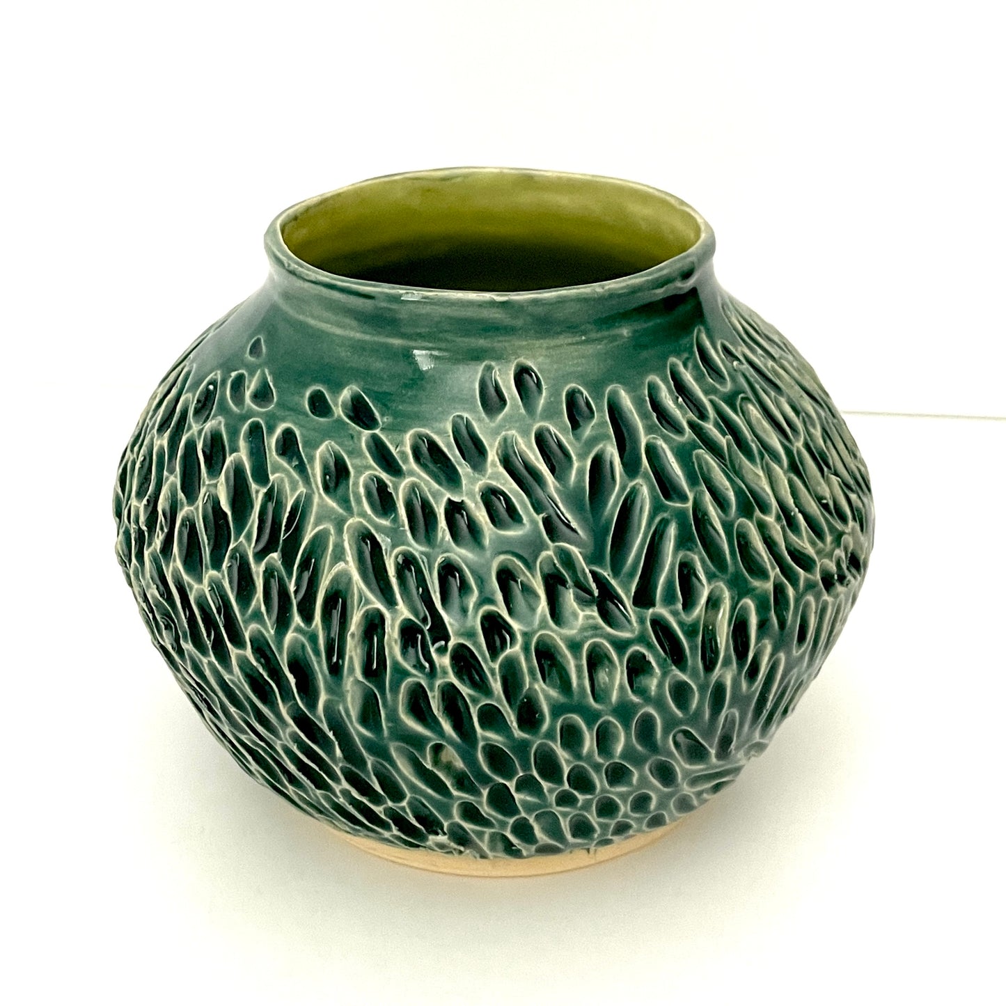 Deep green, low carved vase