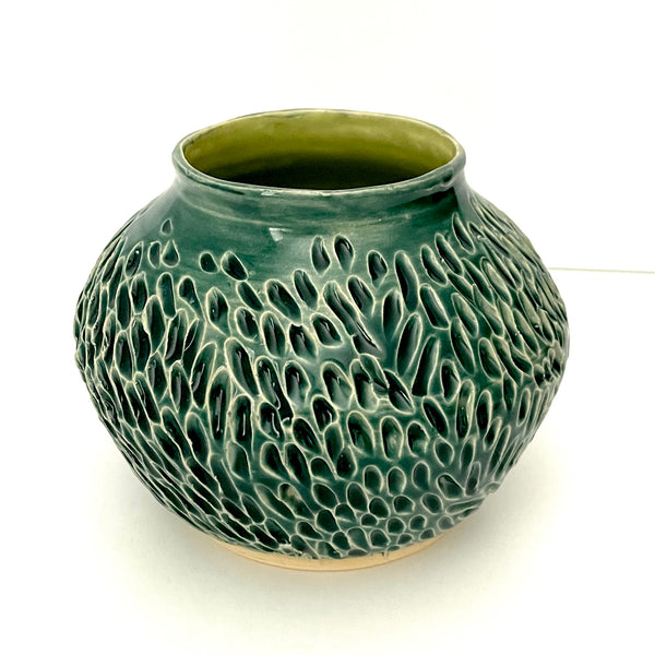 Deep green, low carved vase
