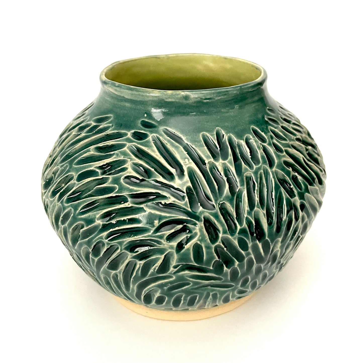 Deep green, low carved vase