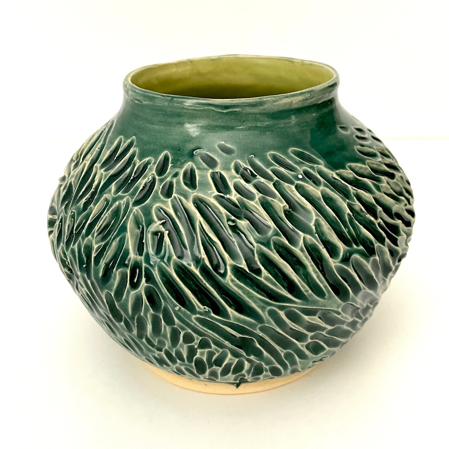 Deep green, low carved vase