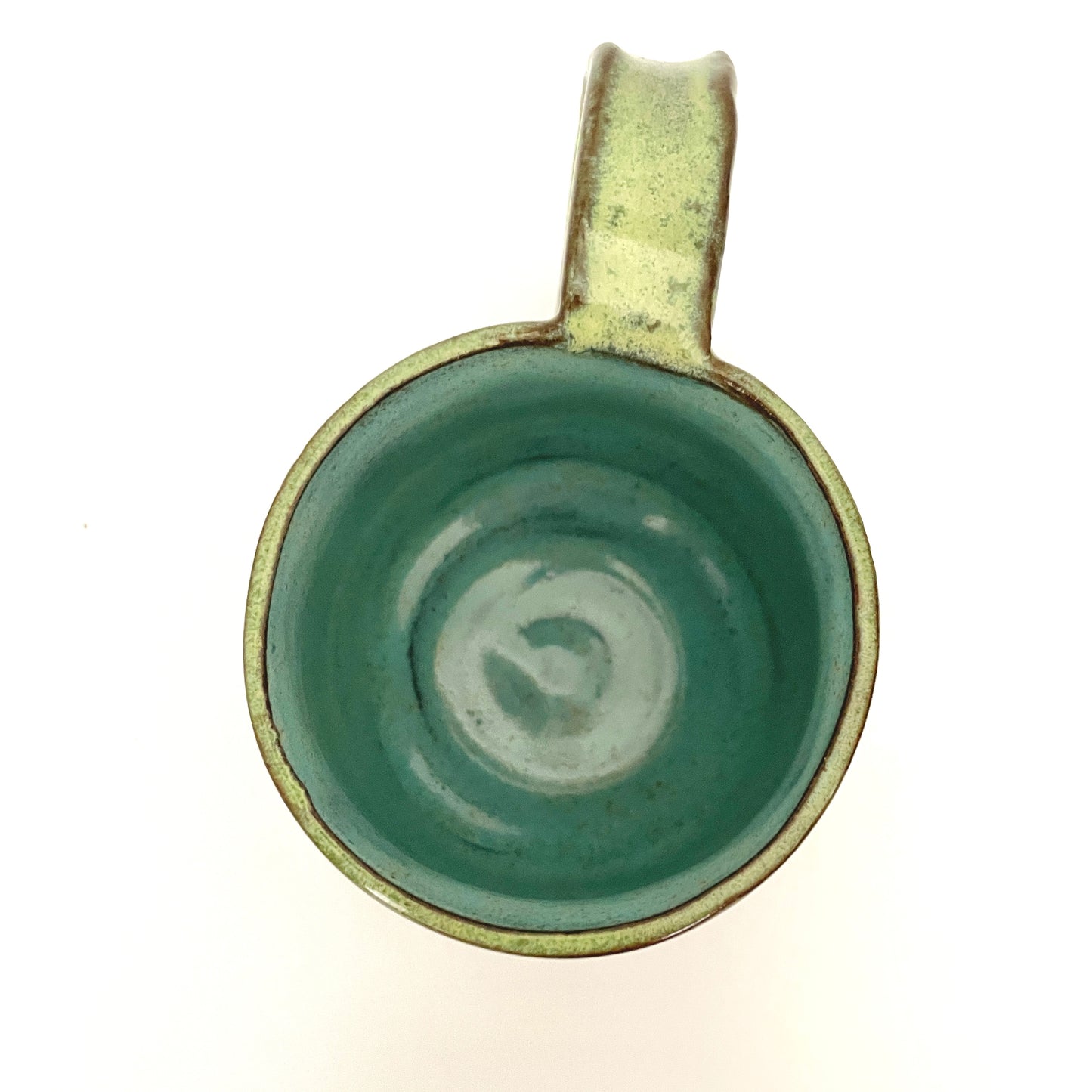 Green with Turquoise Interior Mug on Dark Clay