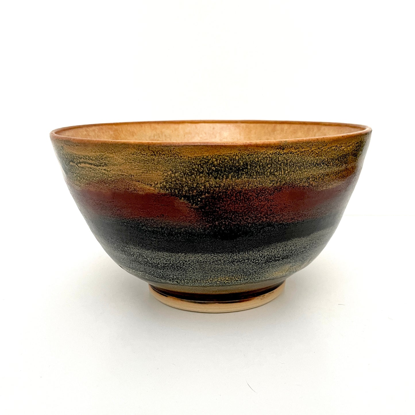 Large ceramic serving bowl in multicolor stripes and tones