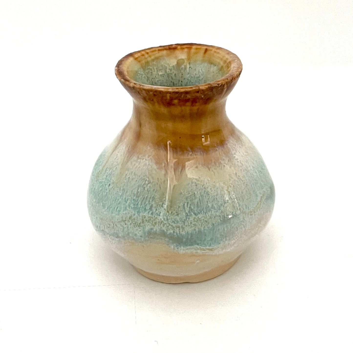 Decorative mini vases in white, seafoam green and rust.
