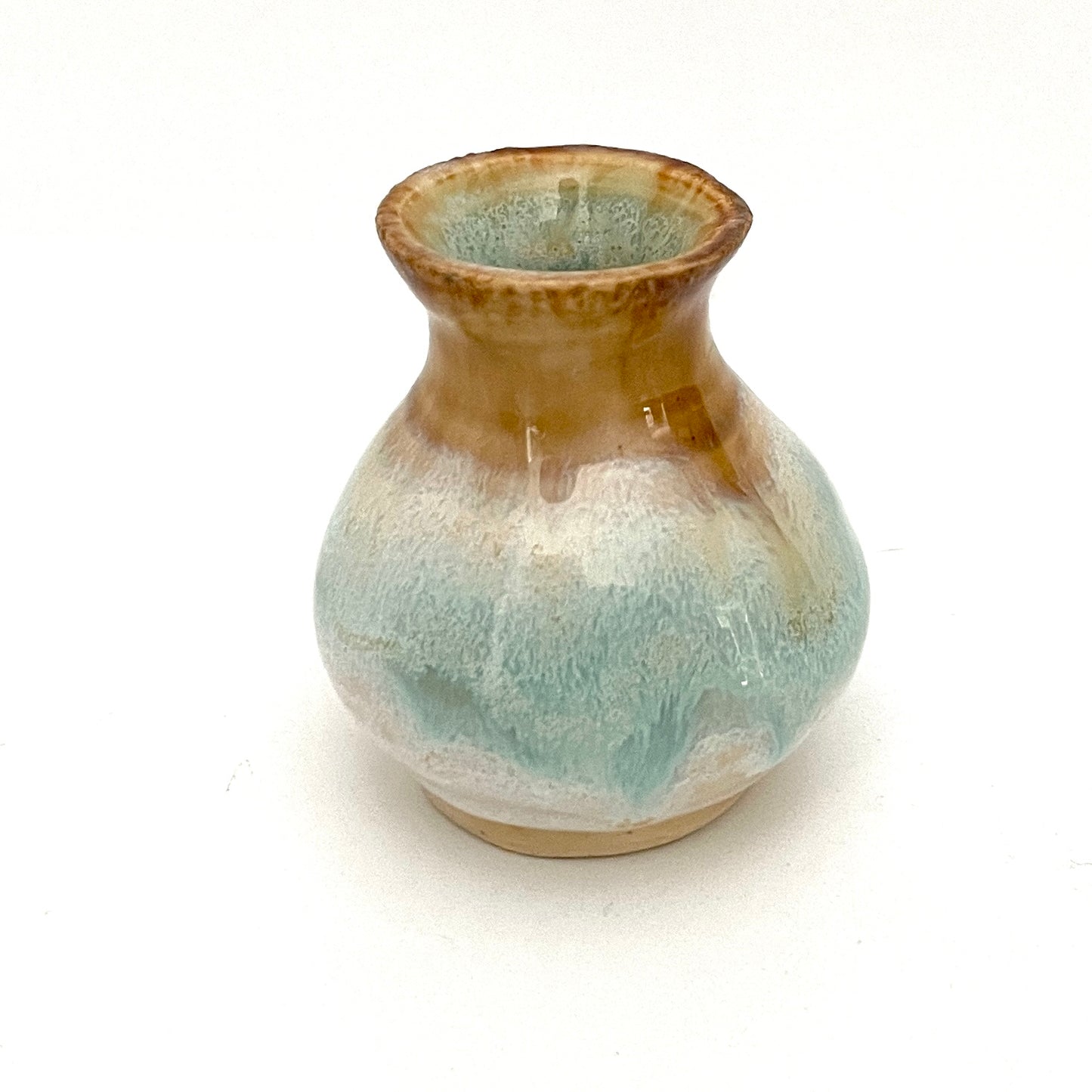 Decorative mini vases in white, seafoam green and rust.