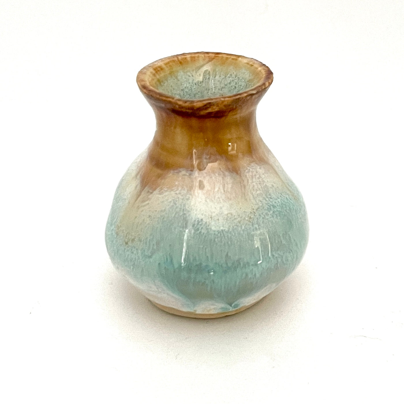 Decorative mini vases in white, seafoam green and rust.