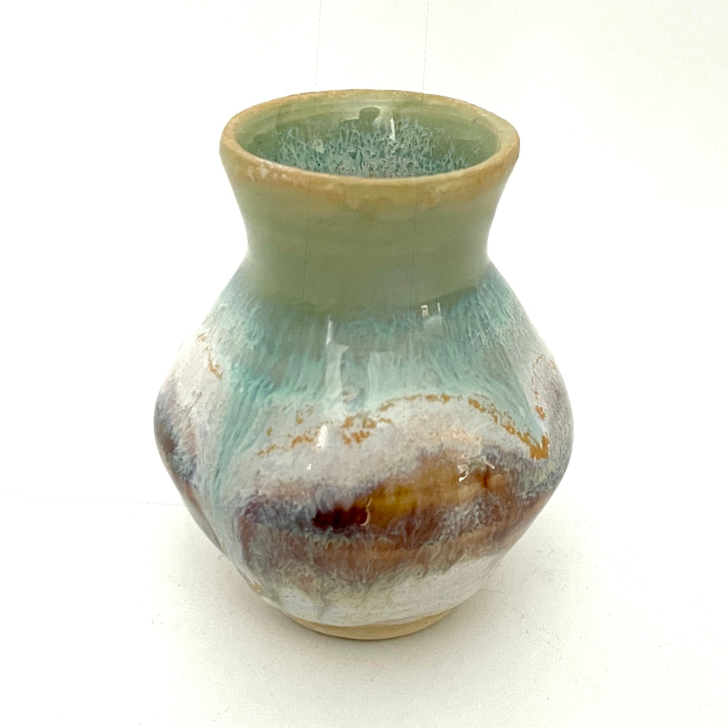 Decorative mini vases in white, seafoam green and rust.