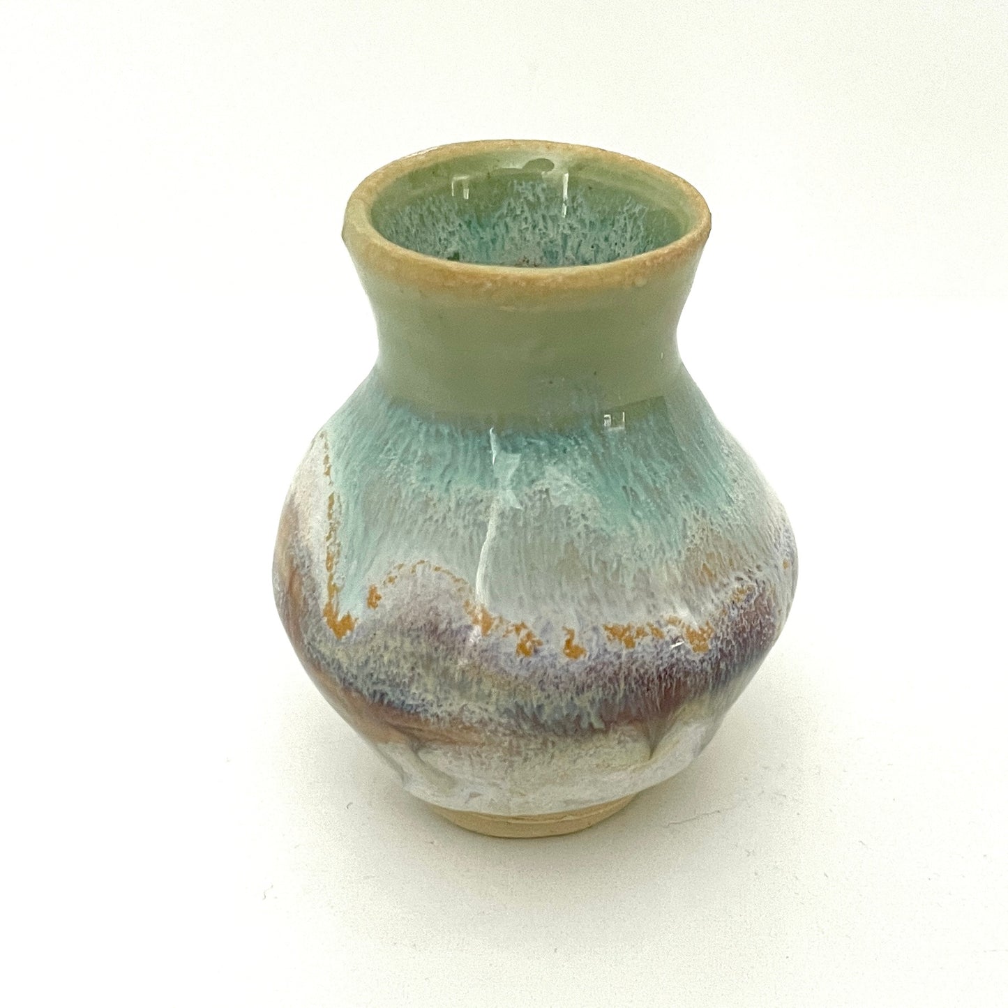 Decorative mini vases in white, seafoam green and rust.