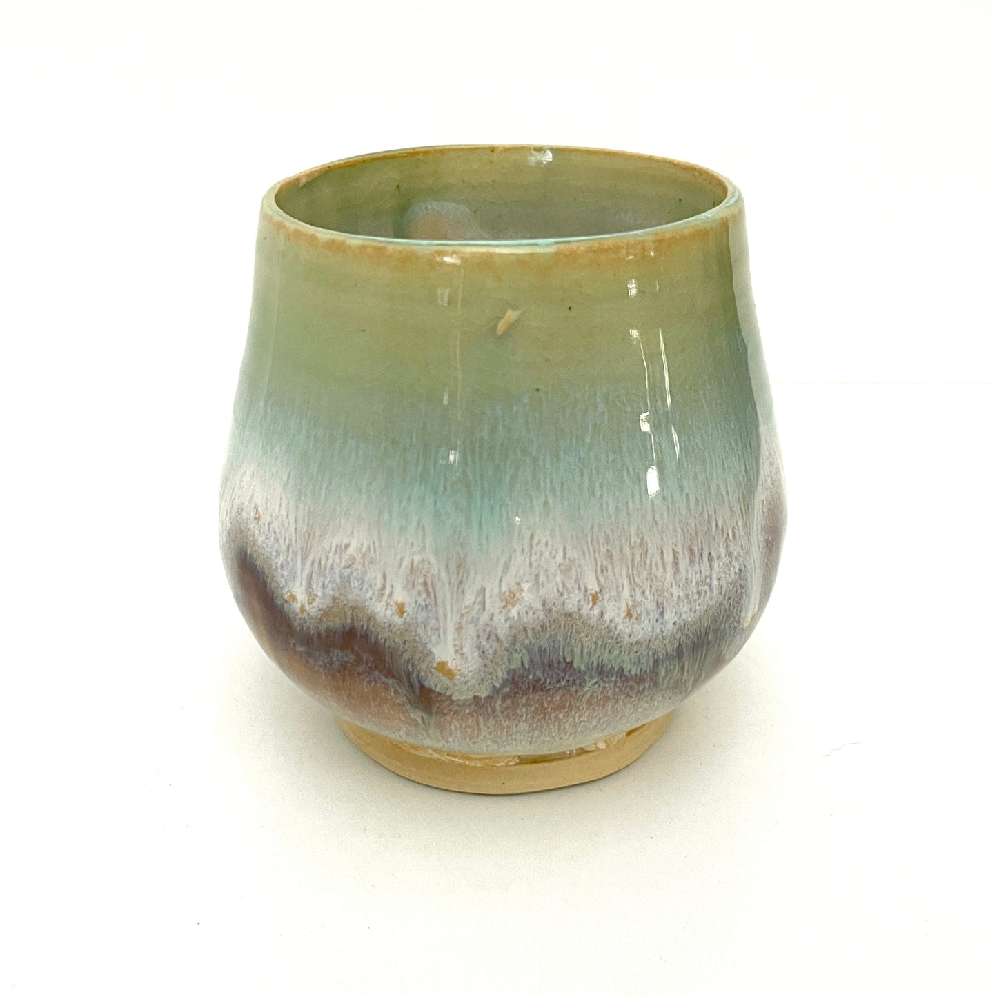 Small Delicate tea or drink cups in tones of white, seafoam and rust.