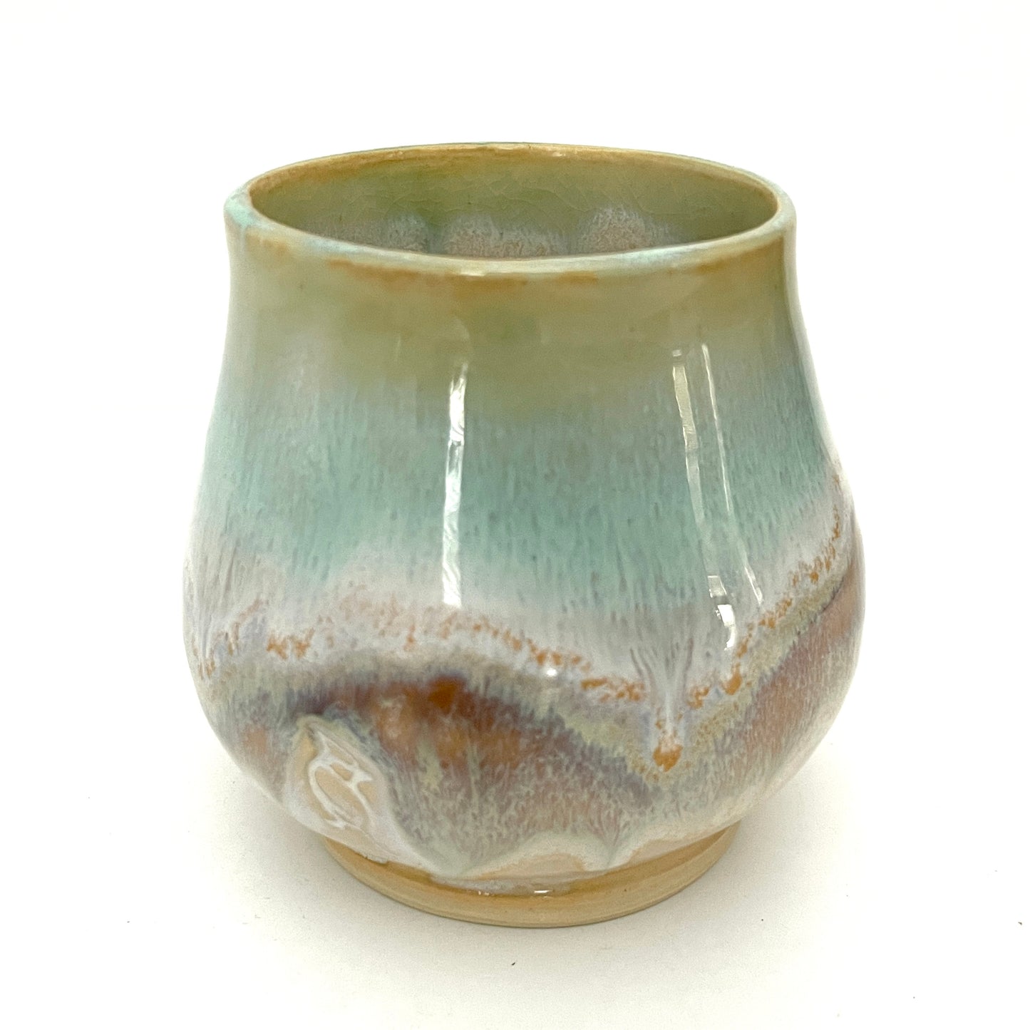 Small Delicate tea or drink cups in tones of white, seafoam and rust.